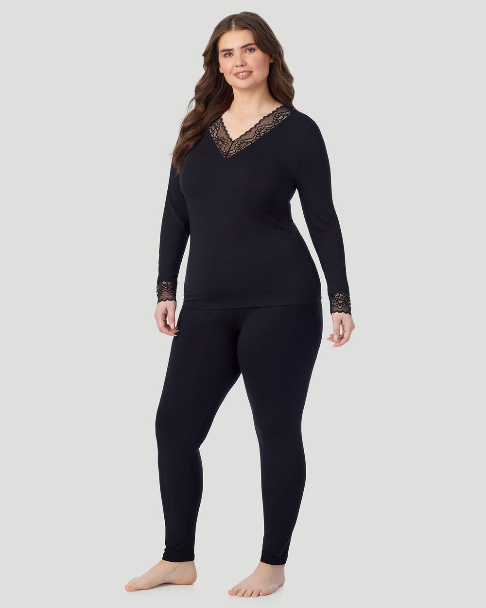 A plus size lady wearing black Softwear With Stretch Long Sleeve V-Neck With Lace PLUS in a front view standing look