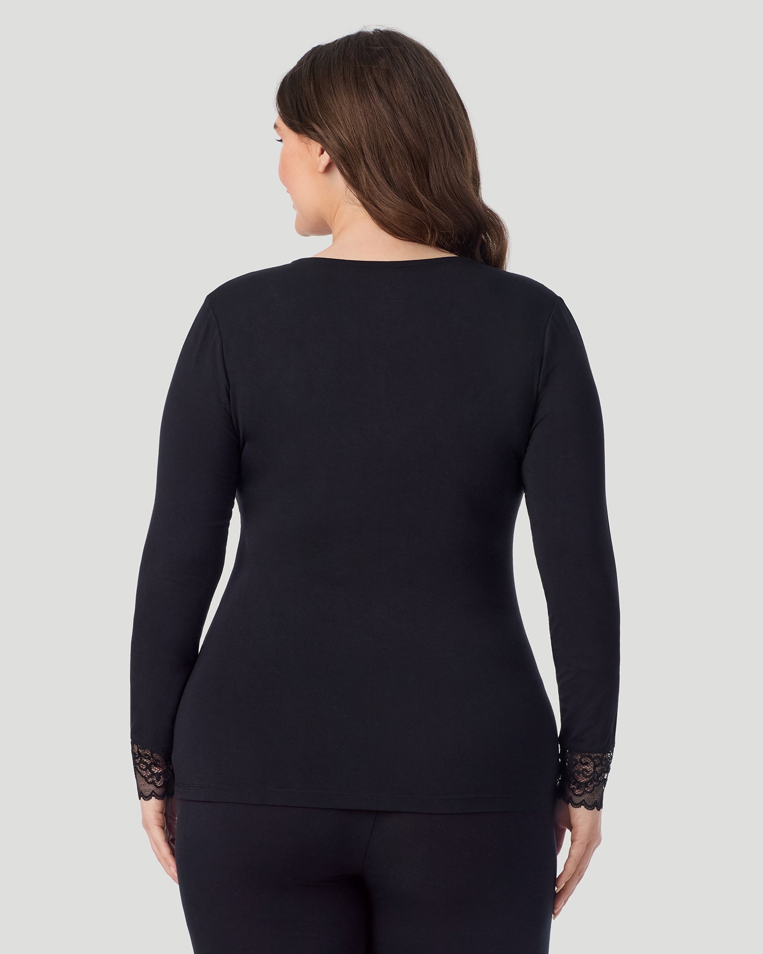 Black; Model is wearing size 1X. She is 5'10", Bust 44", Waist 36", Hips 49". @A plus size lady wearing black Softwear With Stretch Long Sleeve V-Neck With Lace PLUS in a front view pose