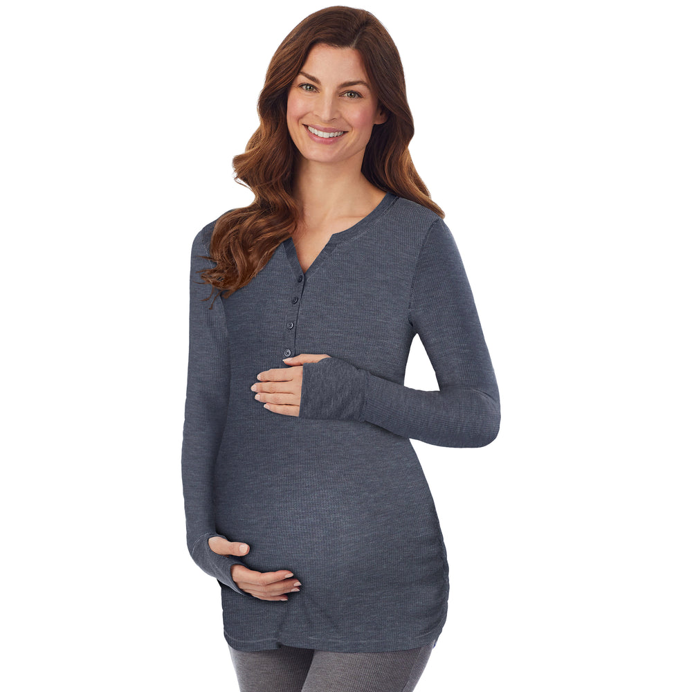 A lady wearing a Navy Blazer Heather long sleeve split V-Neck henley. #Model is wearing a maternity bump.