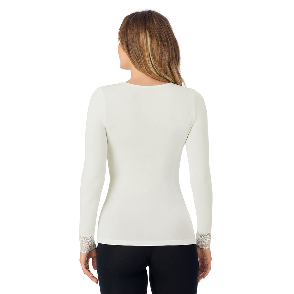 A lady is wearing Softwear With Stretch Long Sleeve V-Neck With Lace
