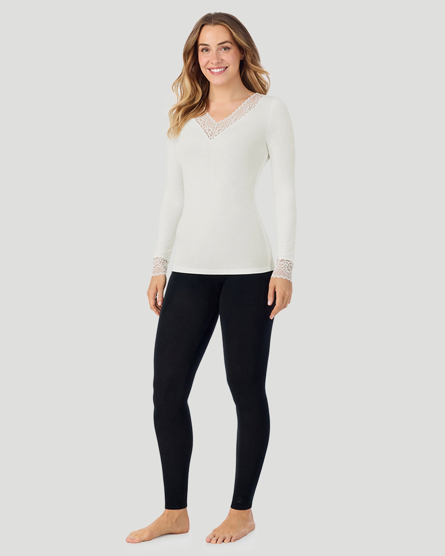 Ivory; Model is wearing size S. She is 5'11.5", Bust 34", Waist 26", Hips 37". @A lady wearing Softwear With Stretch Long Sleeve V-Neck With Lace in ivory shown in a front view standing pose