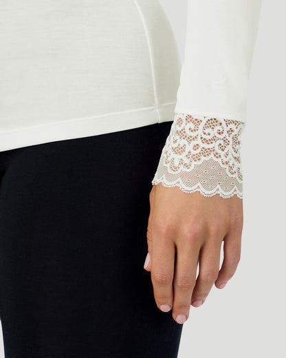 A lady wearing Softwear With Stretch Long Sleeve V-Neck With Lace in ivory shown in a front view sleeve close up shot