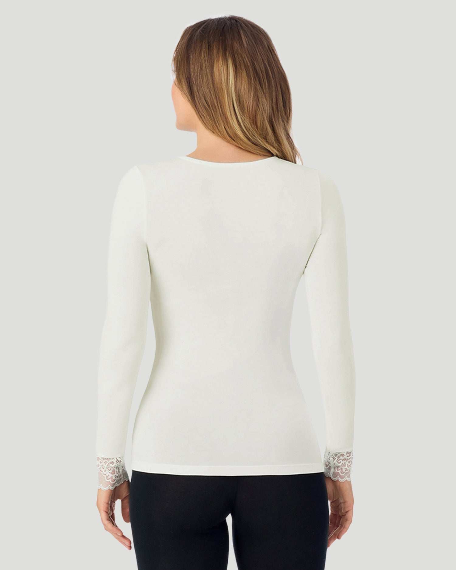 A lady wearing Softwear With Stretch Long Sleeve V-Neck With Lace in ivory shown in a back view pose