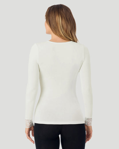 A lady wearing Softwear With Stretch Long Sleeve V-Neck With Lace in ivory shown in a back view pose