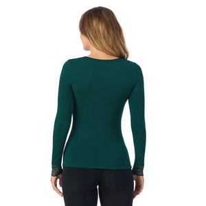 A lady is wearing Softwear With Stretch Long Sleeve V-Neck With Lace
