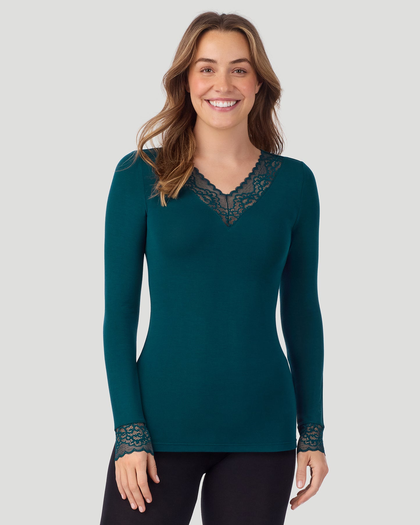 Deep Emerald; Model is wearing a size S. She is 5’11.5”, Bust 34”, Waist 27”, Hips 38.5”. @A lady wearing Softwear With Stretch Long Sleeve V-Neck With Lace in deep emerald shown in a front view pose