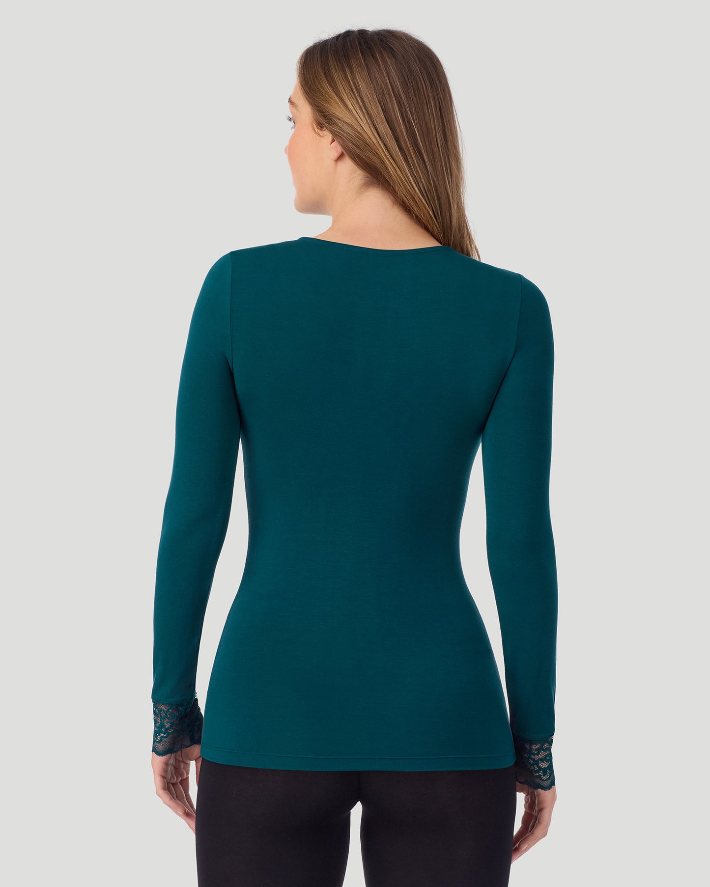 Deep Emerald; Model is wearing a size S. She is 5’11.5”, Bust 34”, Waist 27”, Hips 38.5”. @A lady wearing Softwear With Stretch Long Sleeve V-Neck With Lace in deep emerald shown in a back view pose