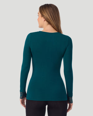 A lady wearing Softwear With Stretch Long Sleeve V-Neck With Lace in deep emerald shown in a back view pose