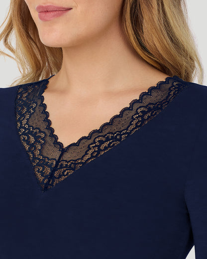 A lady wearing Softwear With Stretch Long Sleeve V-Neck With Lace in navy blazer shown in a front detail close up view