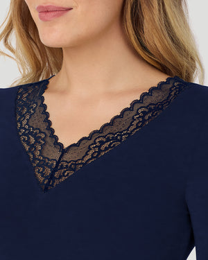 A lady wearing Softwear With Stretch Long Sleeve V-Neck With Lace in navy blazer shown in a front detail close up view