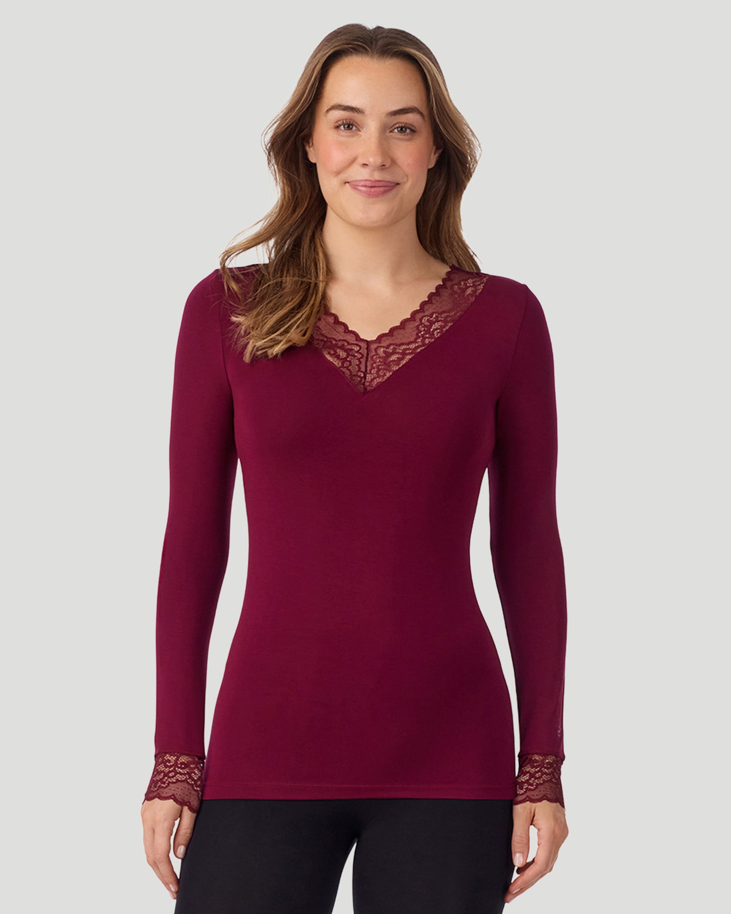 A lady wearing Softwear With Stretch Long Sleeve V-Neck With Lace in scarlet shown in a front view pose