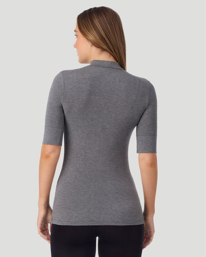 A lady wearing Softwear With Stretch Elbow Sleeve Mock Neck in charcoal heather shown in a back view pose