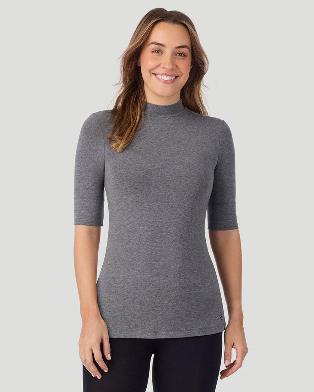 A lady wearing Softwear With Stretch Elbow Sleeve Mock Neck in charcoal heather shown in a front view pose