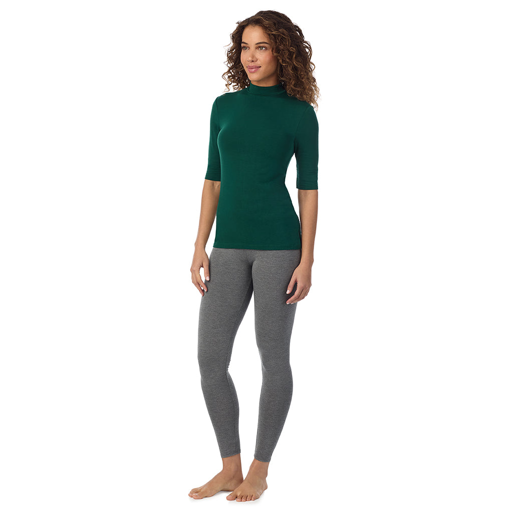 Evergreen; Model is wearing size S. Model is wearing size S. She is 5’9”, Bust 34”, Waist 23”, Hips 35”. @A lady wearing a evergreen elbow sleeve mock neck.