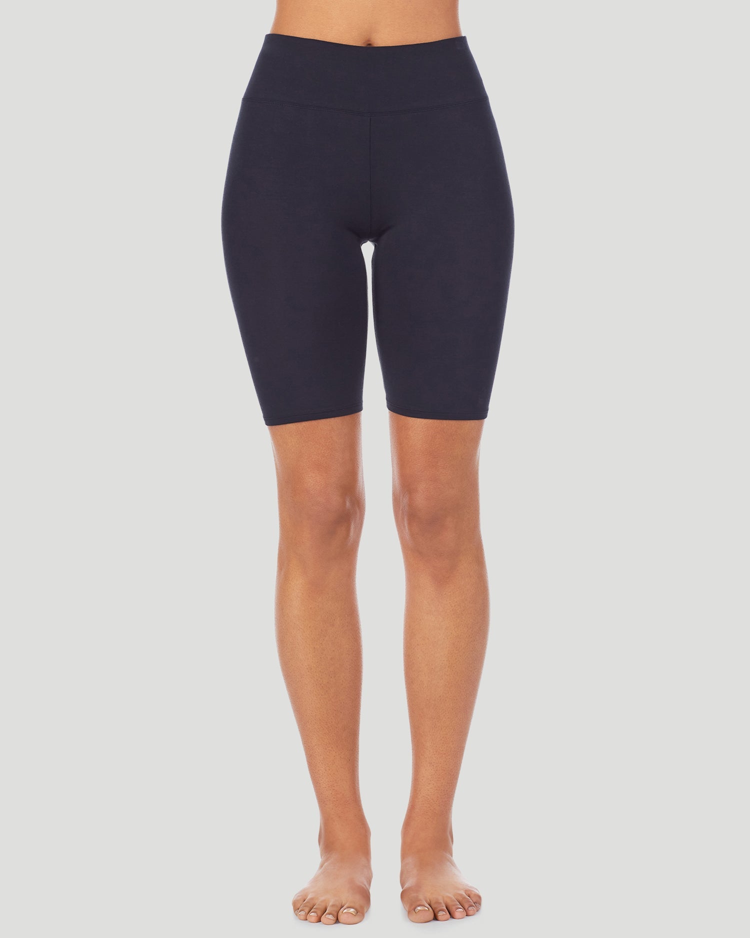 Black; Model is wearing size S. She is 5'8.5", Bust 32", Waist 25", Hips 36". @A lady wearing Softwear With Stretch Short in black shown in a front view pose