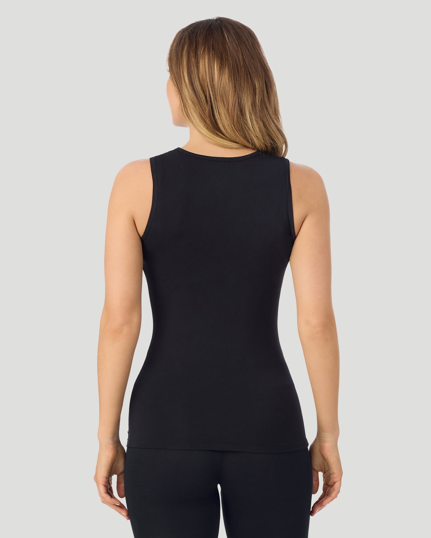 A lady wearing Softwear With Stretch Crew Neck Tank With Lace in black shown in a back view pose