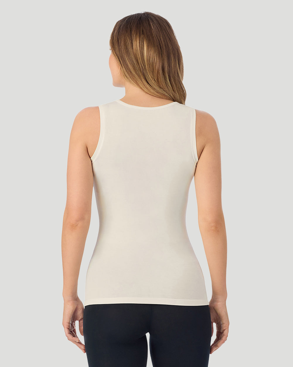 A lady wearing Softwear With Stretch Crew Neck Tank With Lace in ivory shown in a back view pose