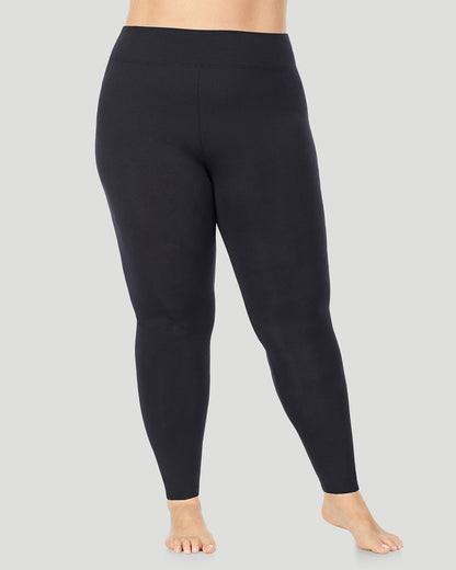 A plus size lady wearing Softwear With Stretch High Waist Legging PLUS in black in a front view pose