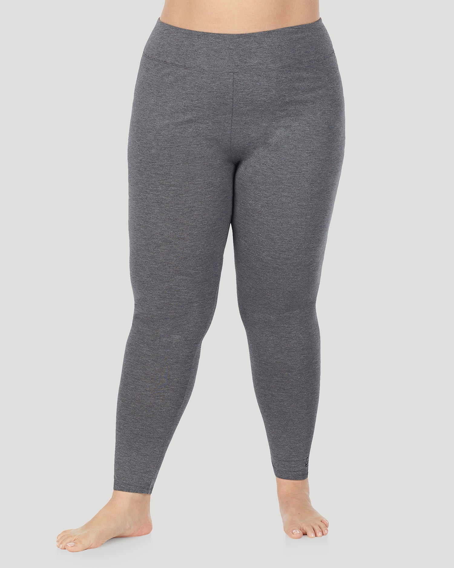 A plus size lady wearing Softwear With Stretch High Waist Legging PLUS in charcoal heather in a front view pose 