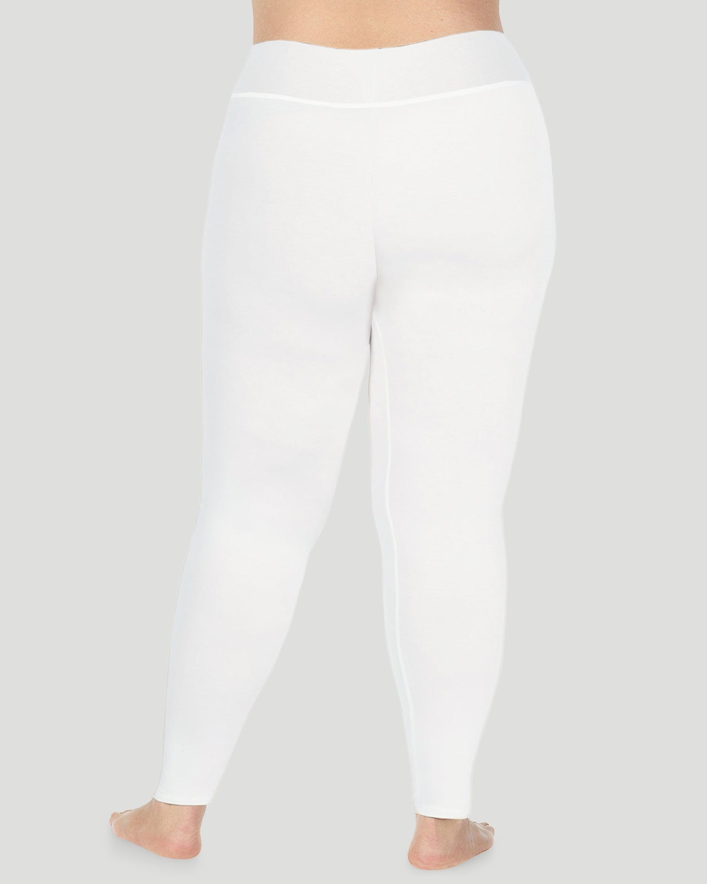 Ivory; Model is wearing size 1X. She is 5'9", Bust 38", Waist 36", Hips 48.5". @A plus size lady wearing Softwear With Stretch High Waist Legging PLUS in ivory in a back view pose 