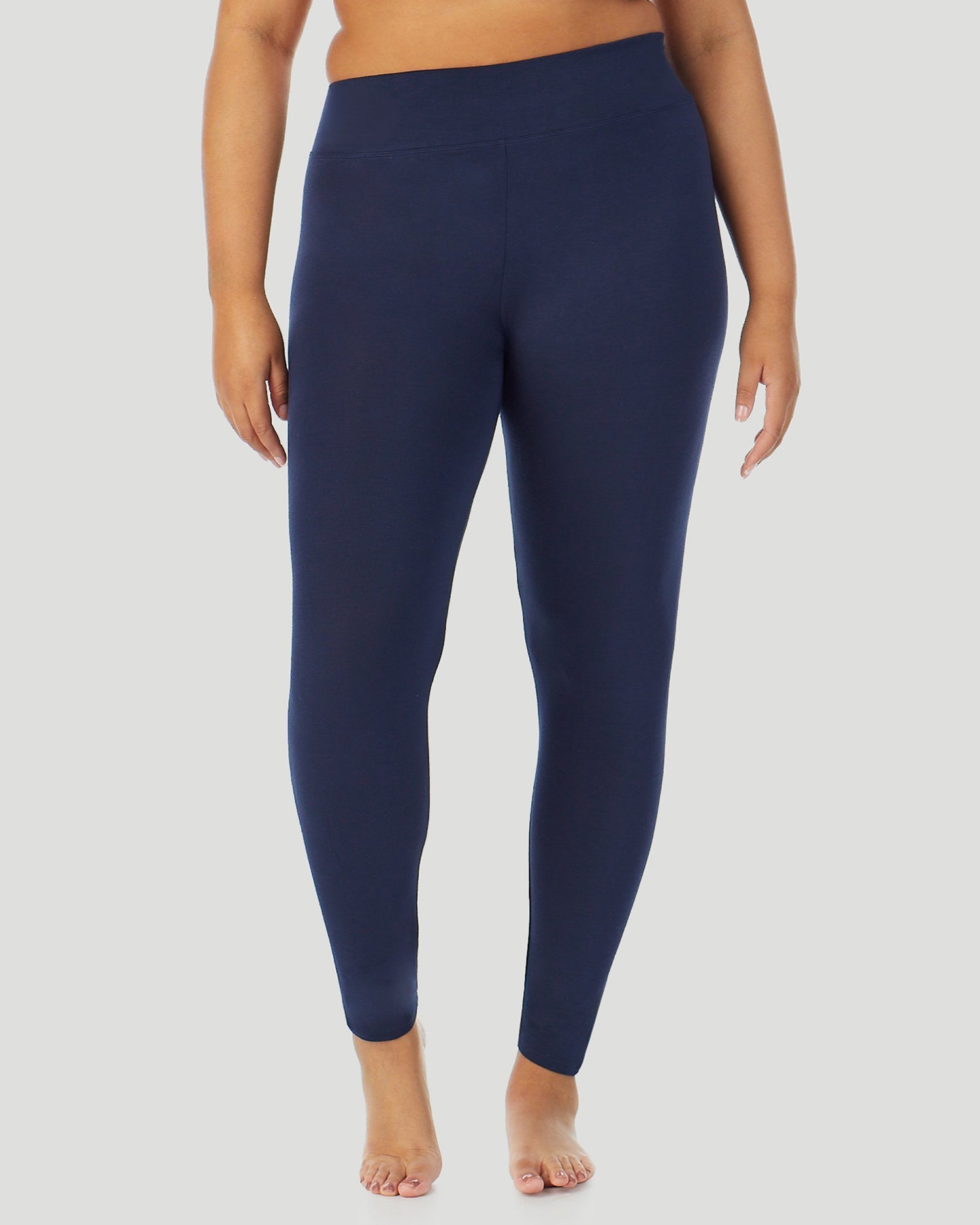 A plus size lady wearing Softwear With Stretch High Waist Legging PLUS in navy blazer in a front view pose 