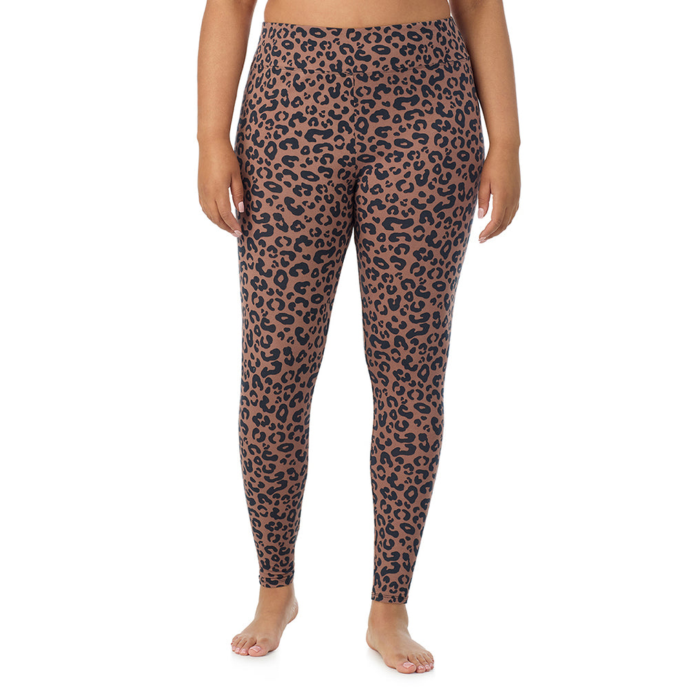 A lady wearing a pecan animal high waist legging plus.