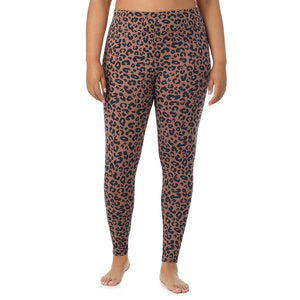 A lady wearing a pecan animal high waist legging plus.