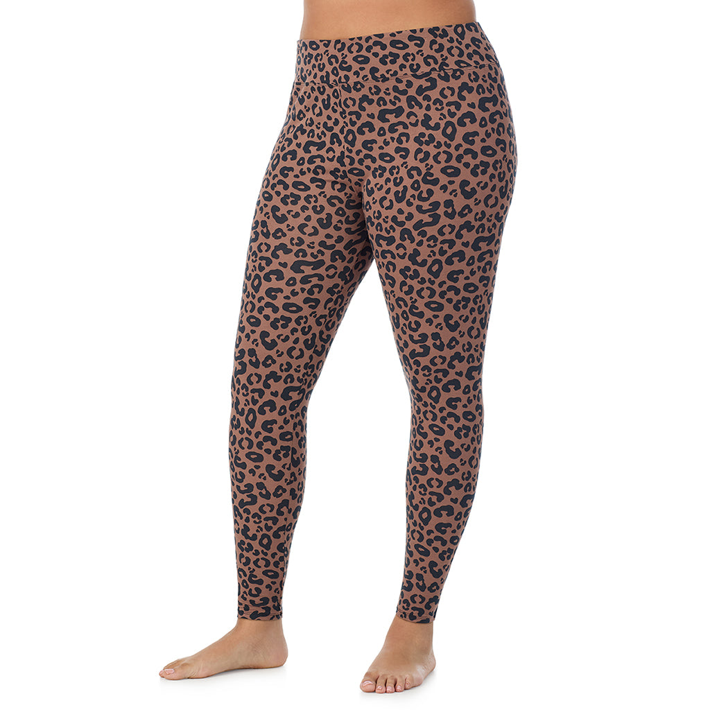 A lady wearing a pecan animal high waist legging plus.