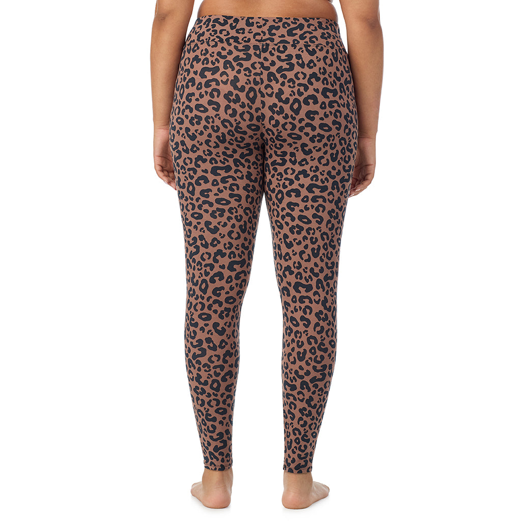 A lady wearing a pecan animal high waist legging plus.