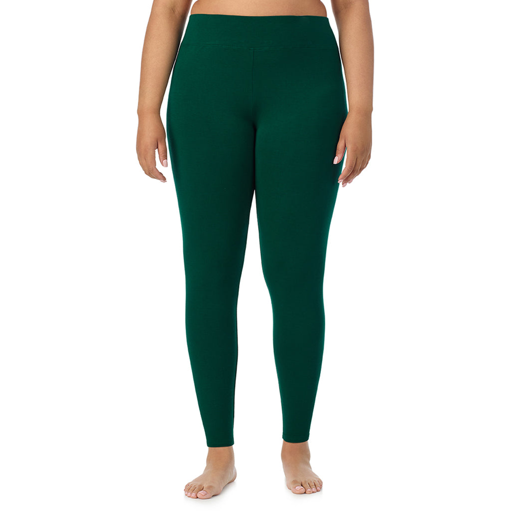 A lady wearing a evergreen high waist legging plus.