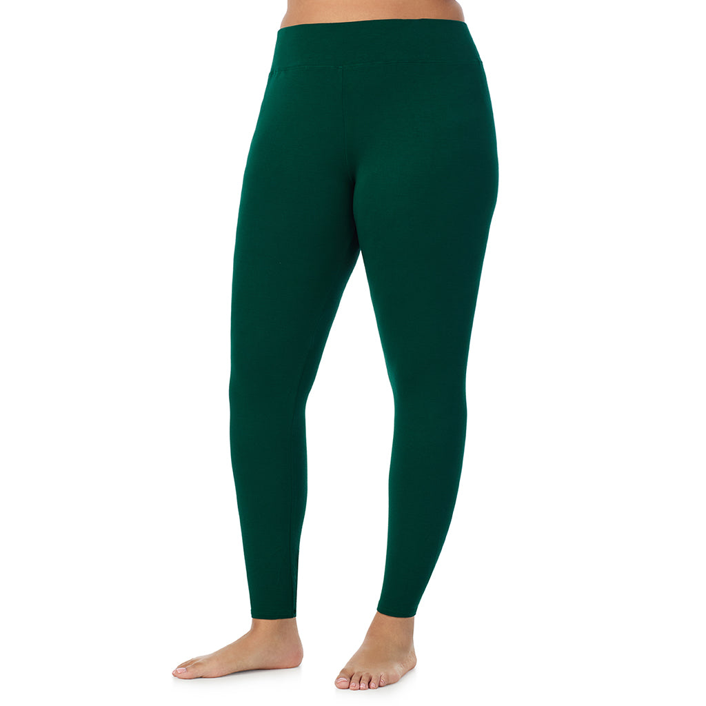 A lady wearing a evergreen high waist legging plus.