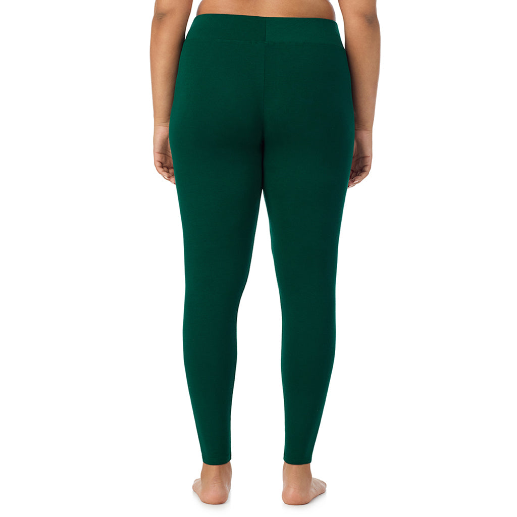 A lady wearing a evergreen high waist legging plus.