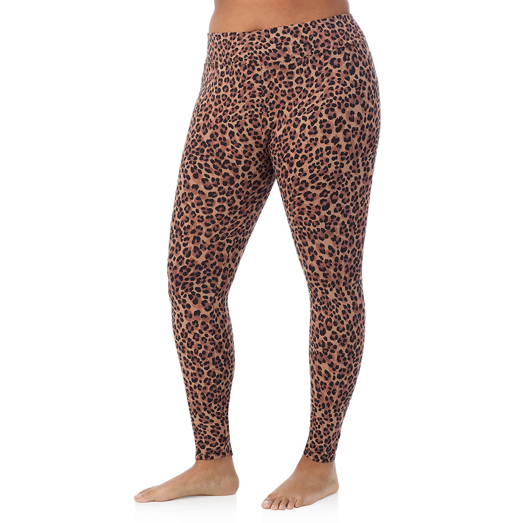 A lady wearing a taupe leopard high waist legging plus.
