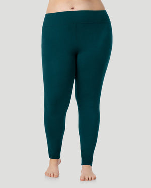A plus size lady wearing Softwear With Stretch High Waist Legging PLUS in deep emerald in a front view pose