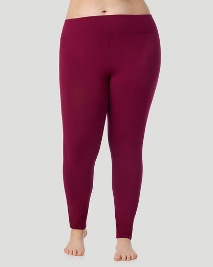A plus size lady wearing Softwear With Stretch High Waist Legging PLUS in scarlet in a front view pose