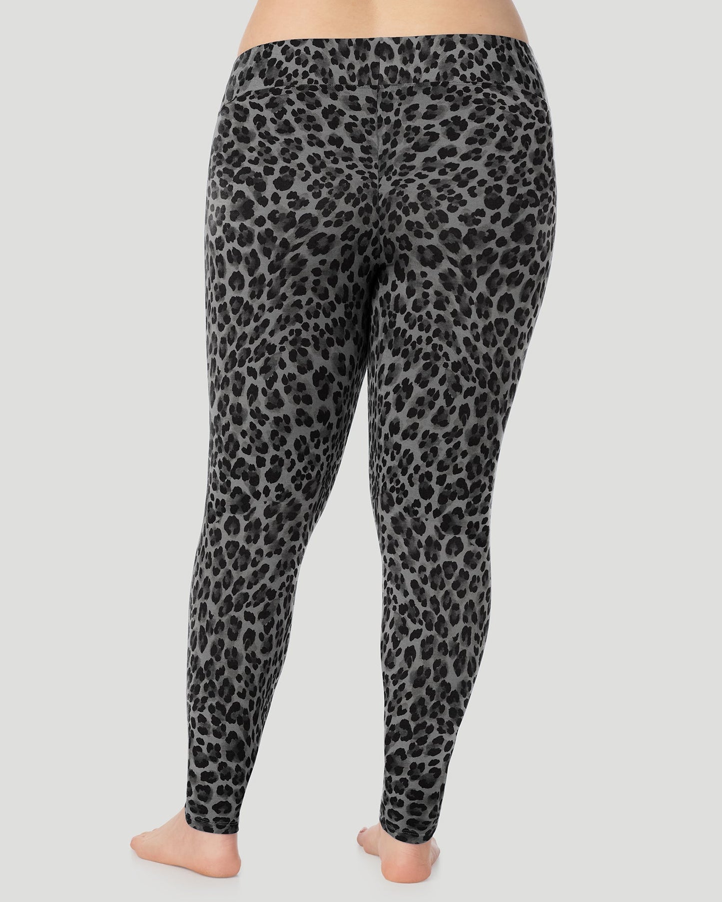 Charcoal Leopard; Model is wearing size 1X. She is 5'10", Bust 44", Waist 36", Hips 49". @A plus size lady wearing Softwear With Stretch High Waist Legging PLUS in charcoal leopard in a back view pose