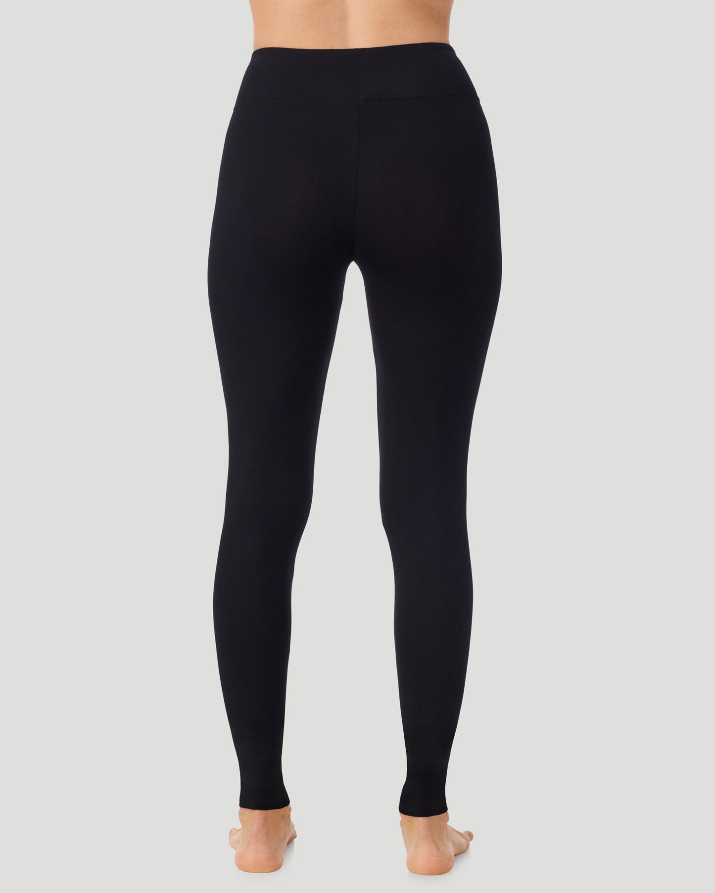 Black; Model is wearing a size S. She is 5’11.5”, Bust 34”, Waist 27”, Hips 38.5”.  @A lady wearing Softwear With Stretch High Waist Legging in black in a back view pose