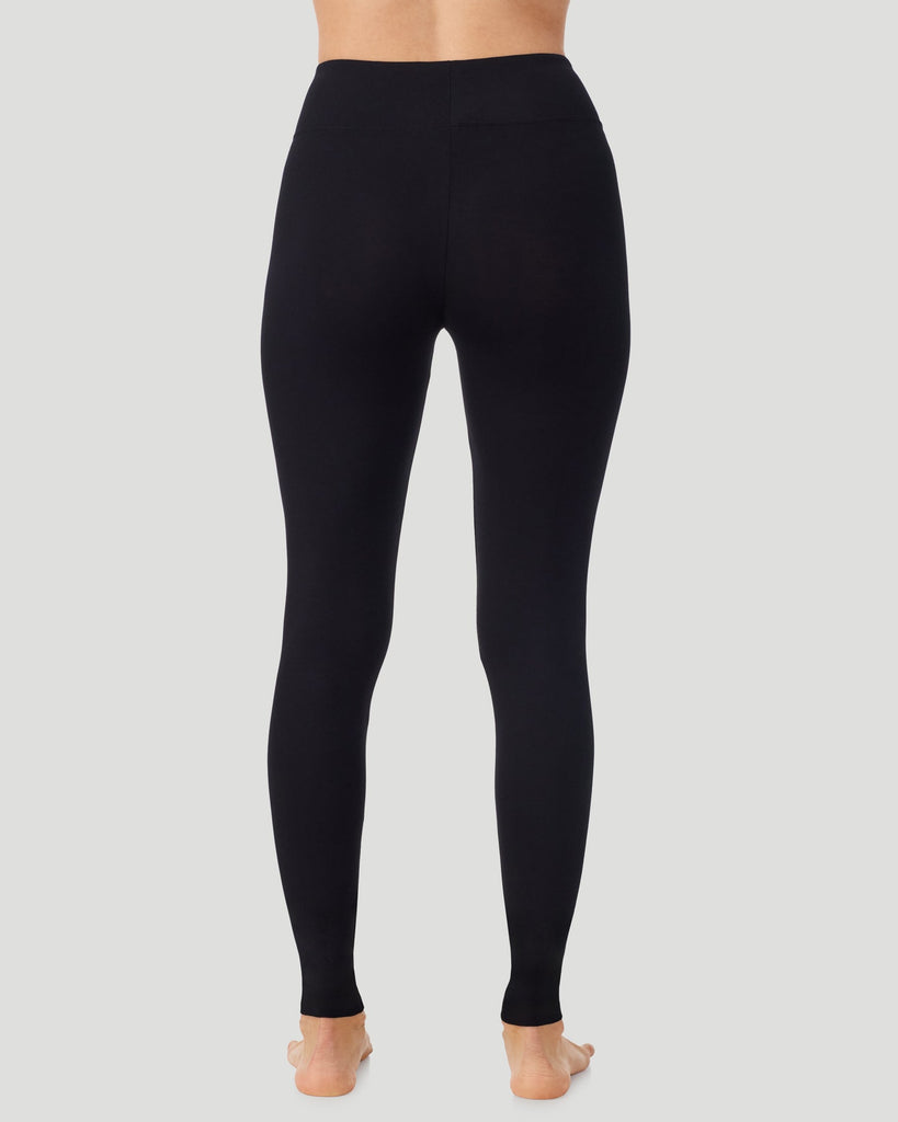 A lady wearing Softwear With Stretch High Waist Legging in black in a back view pose