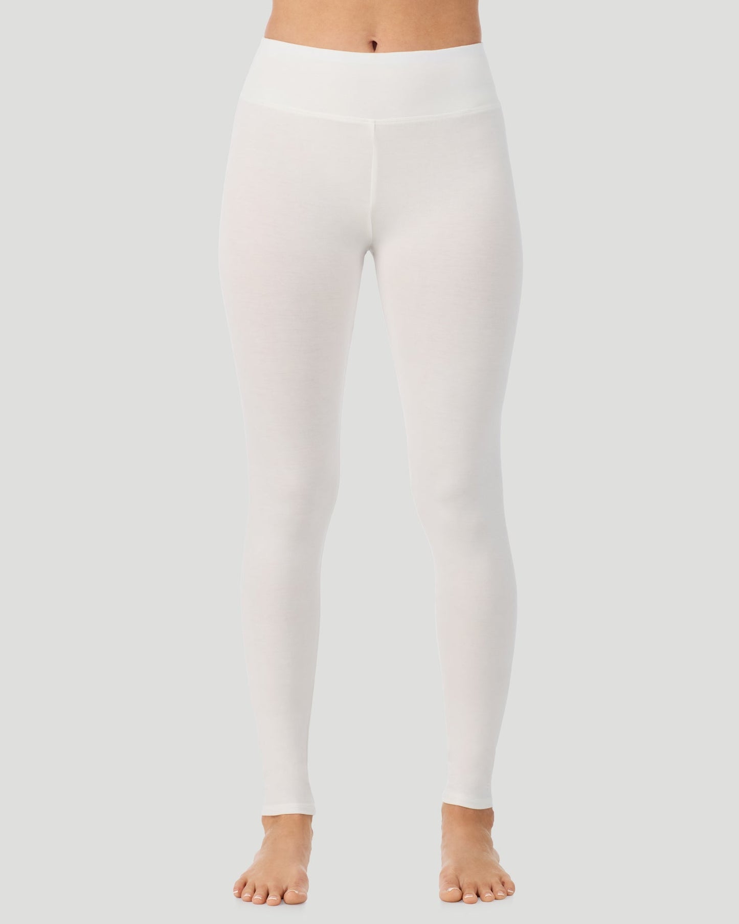 Ivory; Model is wearing a size S. She is 5’11.5”, Bust 34”, Waist 27”, Hips 38.5”.  @A lady wearing Softwear With Stretch High Waist Legging in ivory in a front view pose  