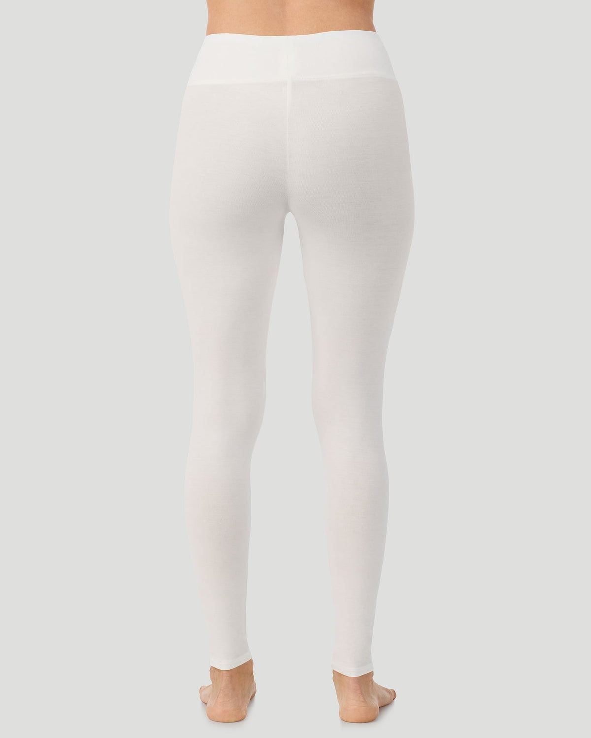 Ivory; Model is wearing a size S. She is 5’11.5”, Bust 34”, Waist 27”, Hips 38.5”.  @A lady wearing Softwear With Stretch High Waist Legging in ivory in a back view pose  