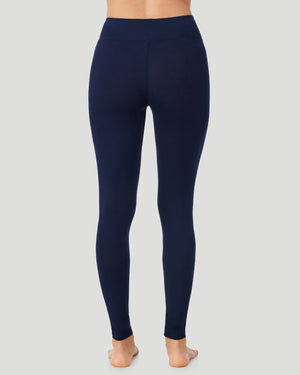 A lady wearing Softwear With Stretch High Waist Legging in navy blazer in a back view pose  