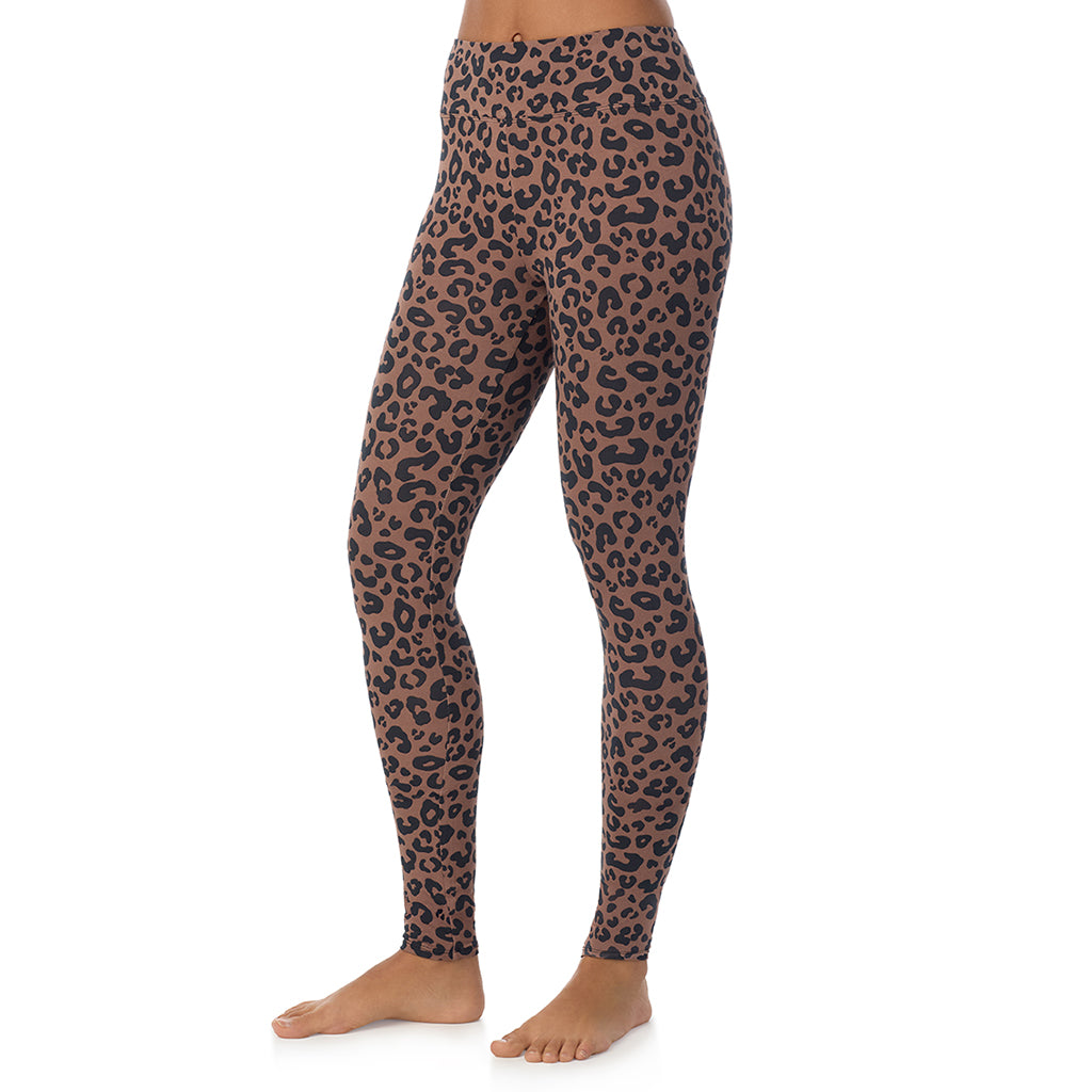 A lady wearing a pecan animal high waist legging.