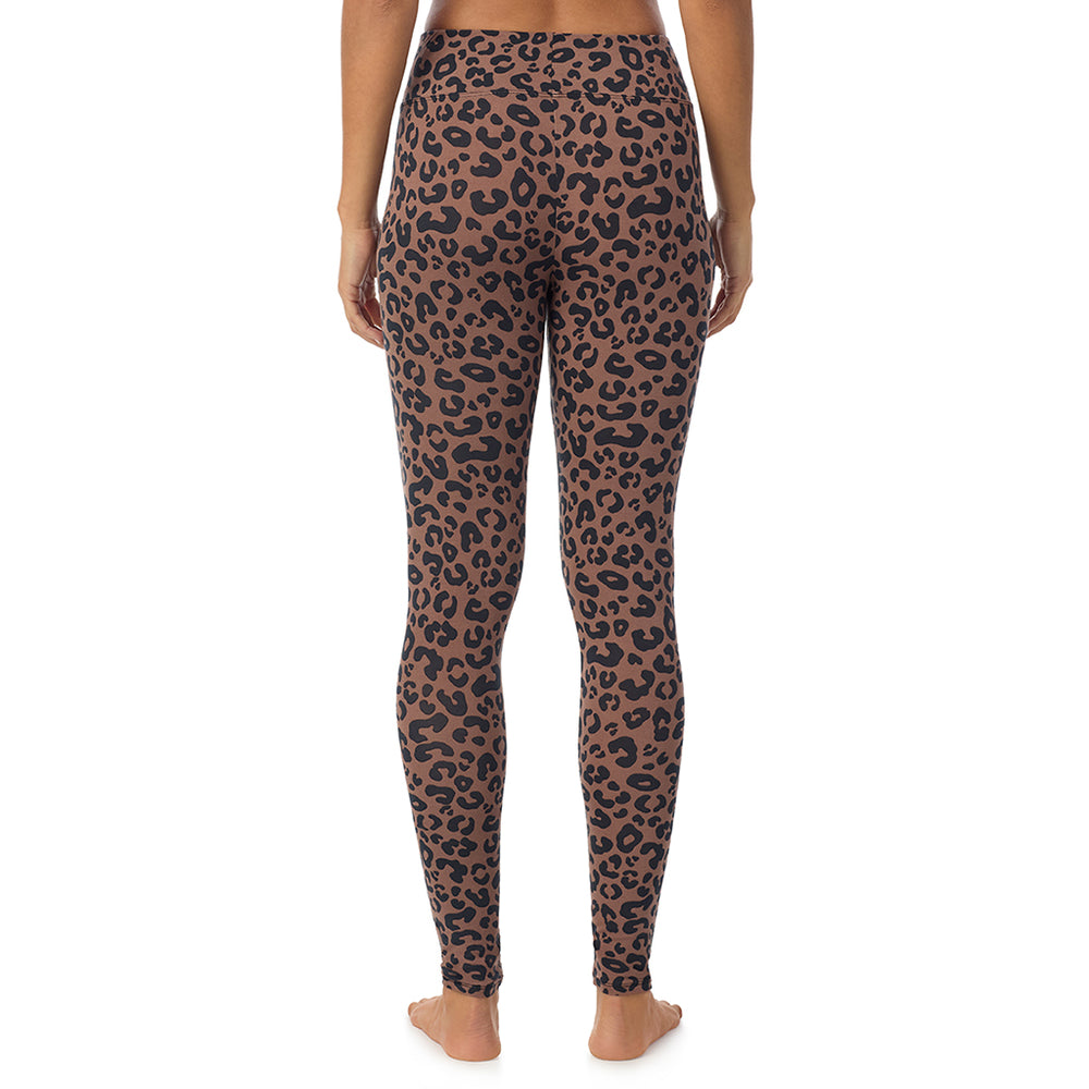 A lady wearing a pecan animal high waist legging.