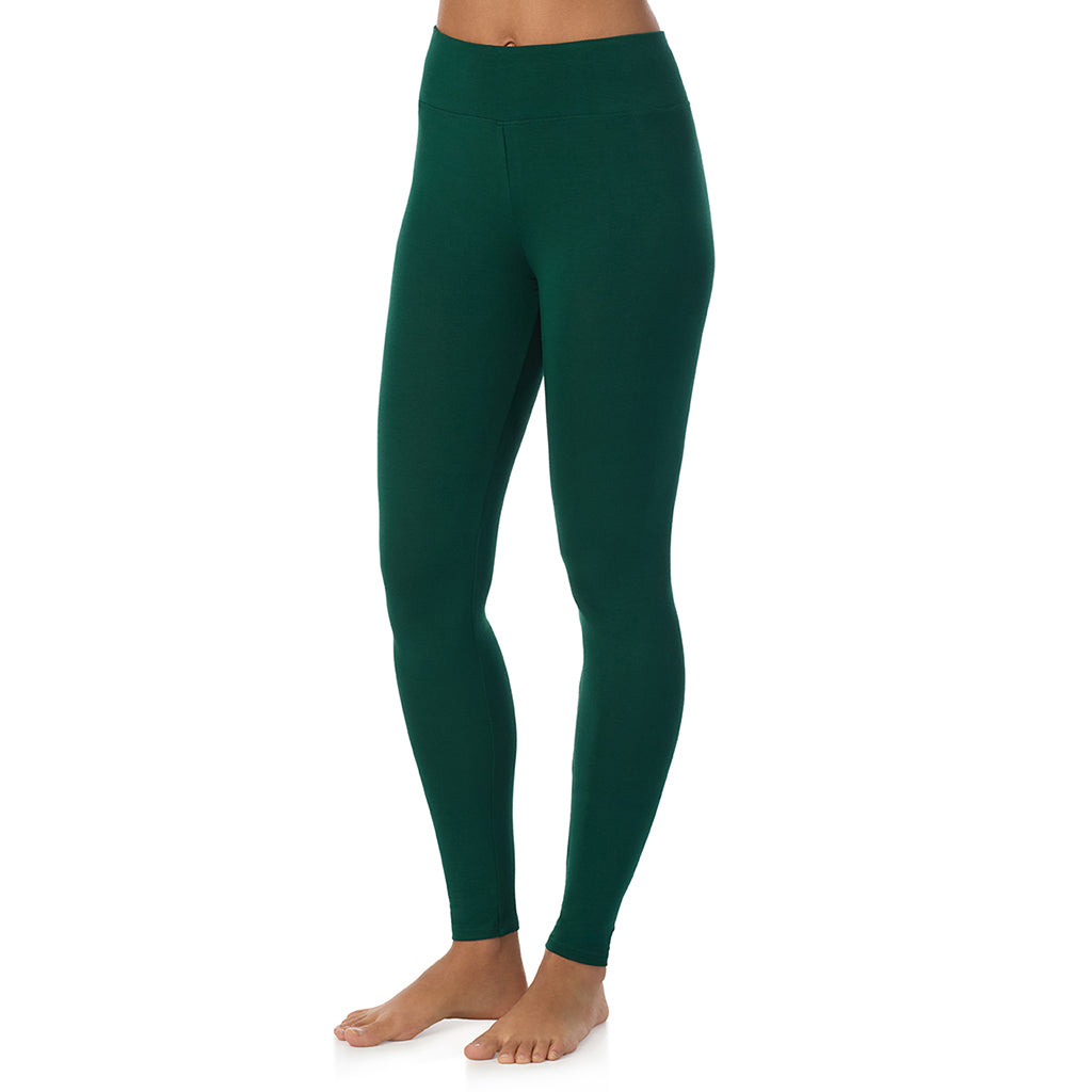 A lady wearing a evergreen high waist legging.