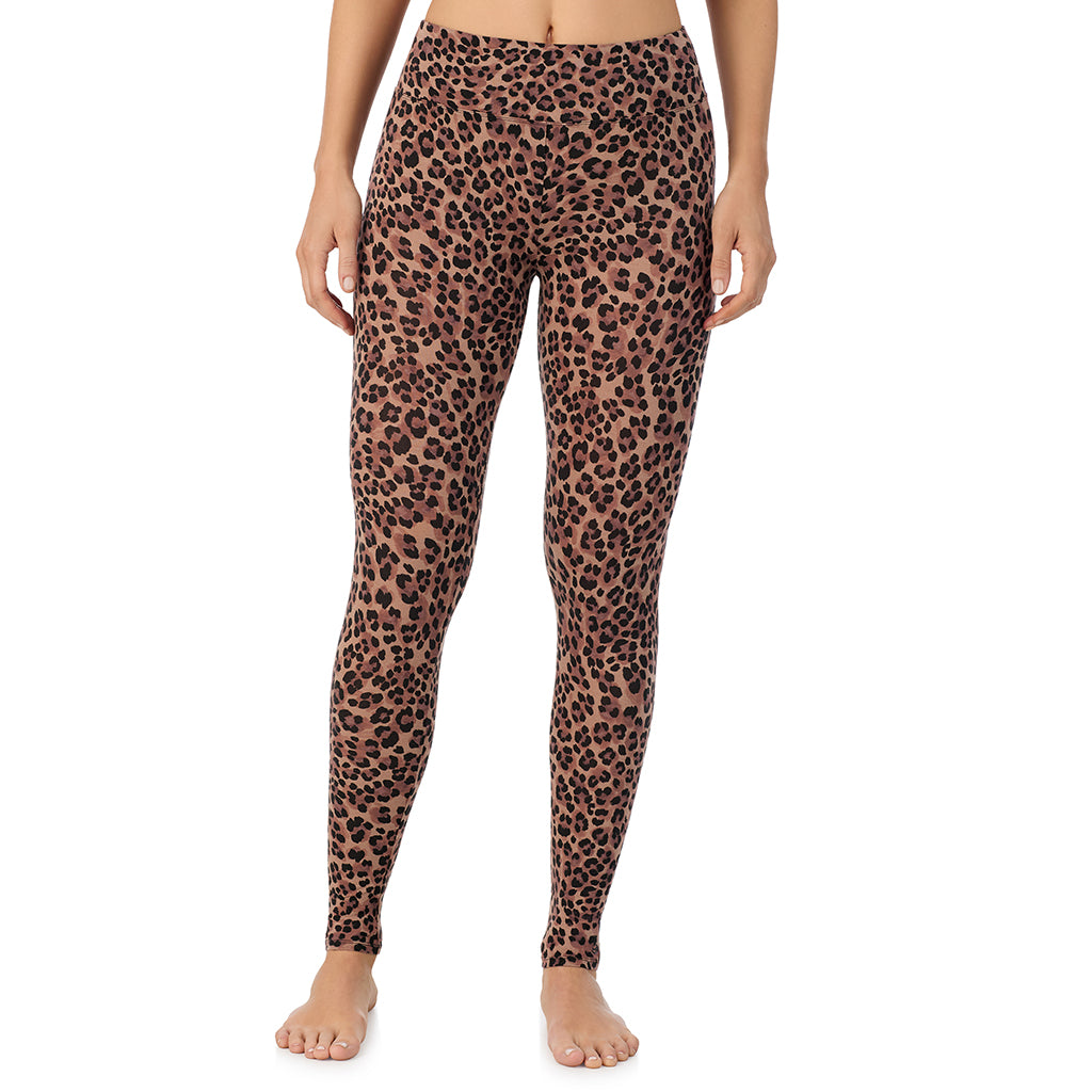 A lady wearing a taupe leopard high waist legging.