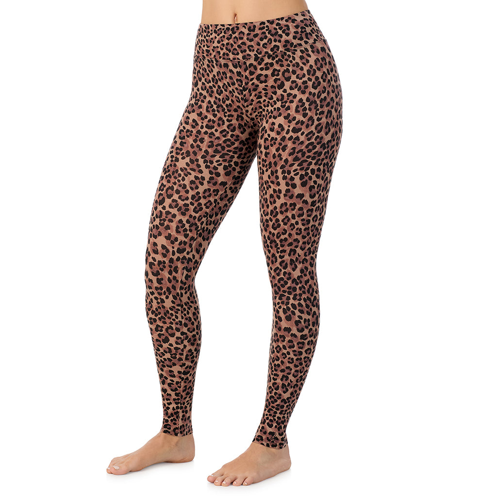 A lady wearing a taupe leopard high waist legging.