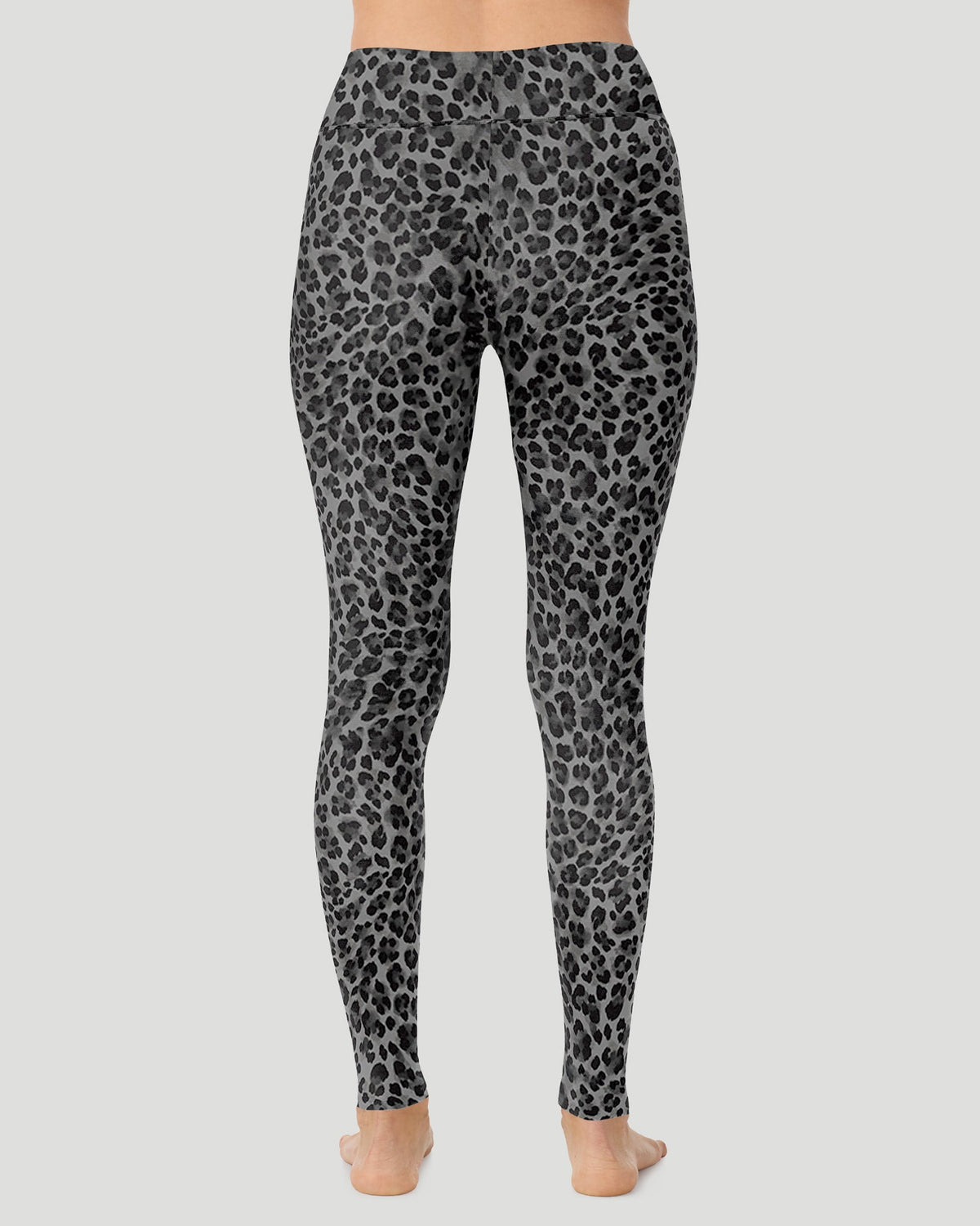 A lady wearing Softwear With Stretch High Waist Legging in charcoal leopard in a back view pose