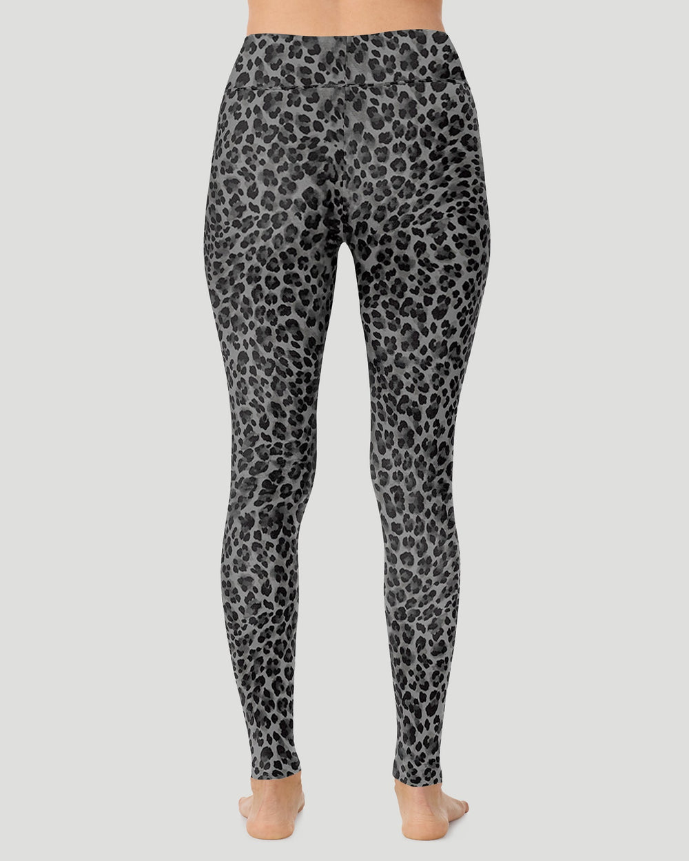 A lady wearing Softwear With Stretch High Waist Legging in charcoal leopard in a back view pose