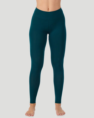 A lady wearing Softwear With Stretch High Waist Legging in deep emerald posing in a clean front view standing position
