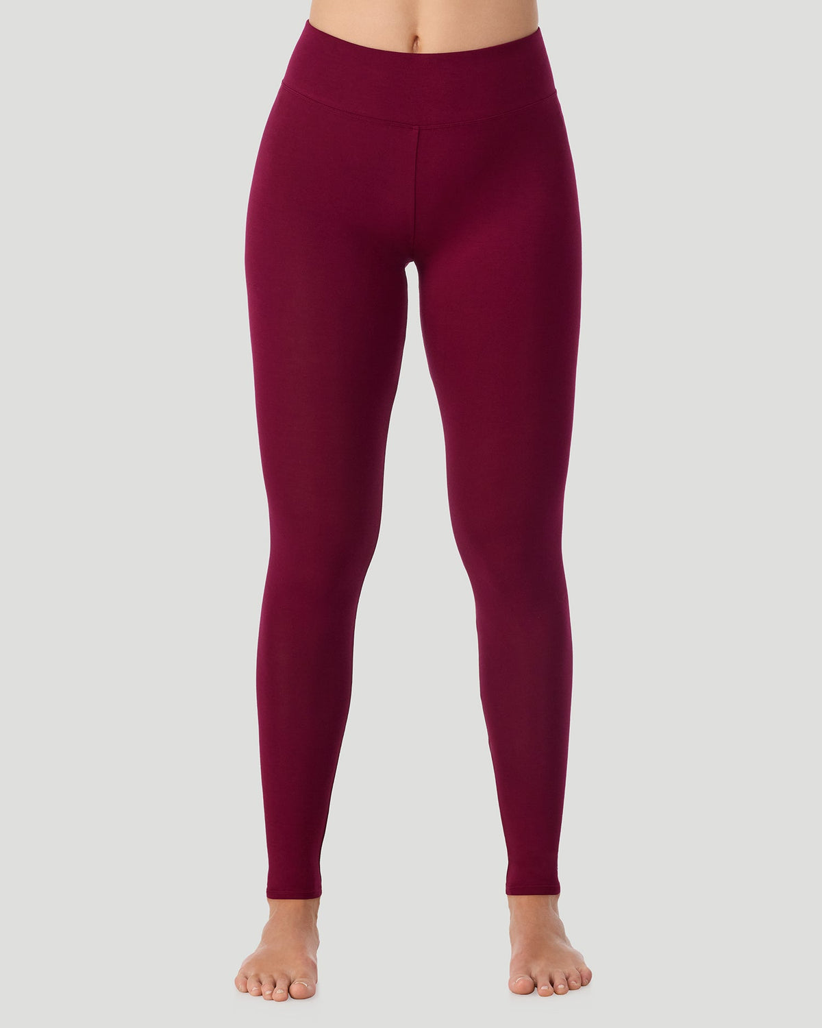 Scarlet; Model is wearing a size S. She is 5’11.5”, Bust 34”, Waist 27”, Hips 38.5”.  @A lady wearing Softwear With Stretch High Waist Legging in scarlet posing in a front view position